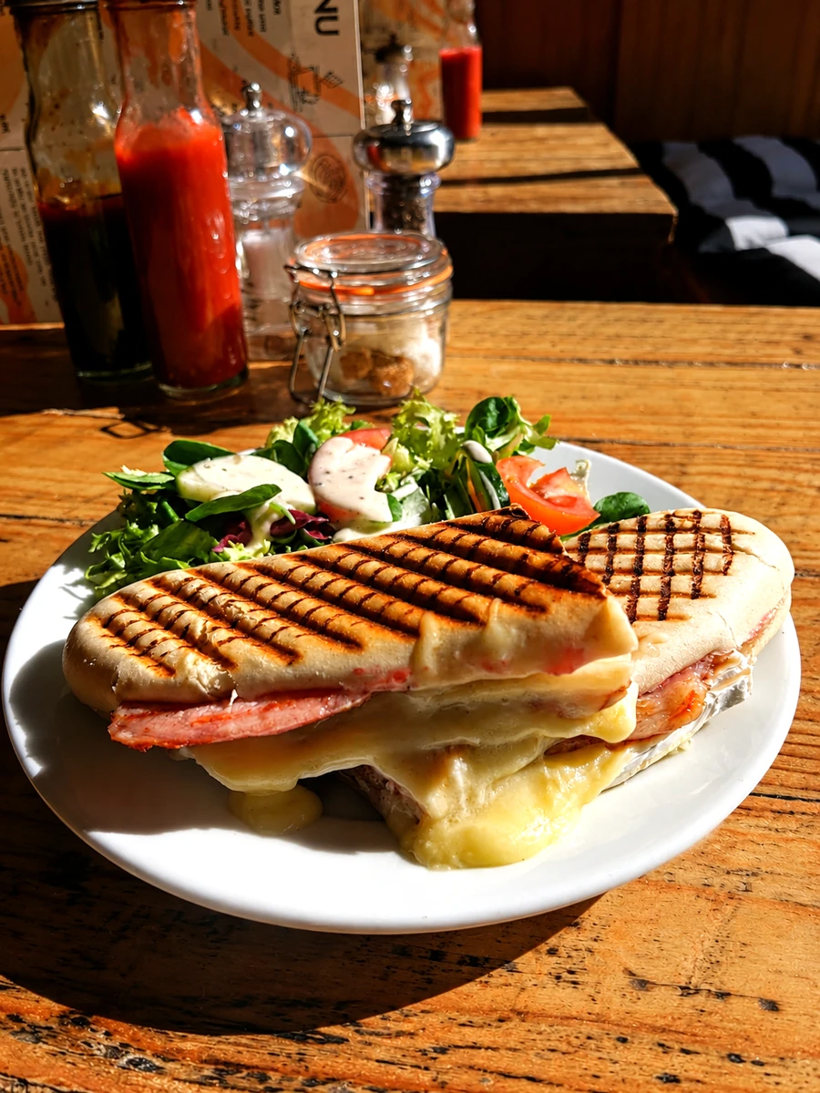 A toasted panini with salad at Cafe on the Cop