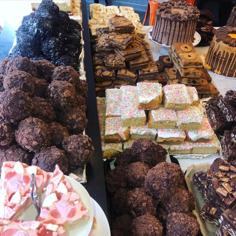 A full counter of cakes and traybakes at Cafe on the Cop